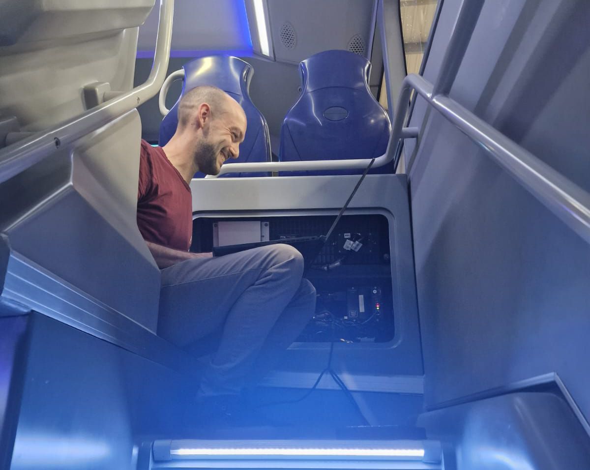 An engineer working inside a bus